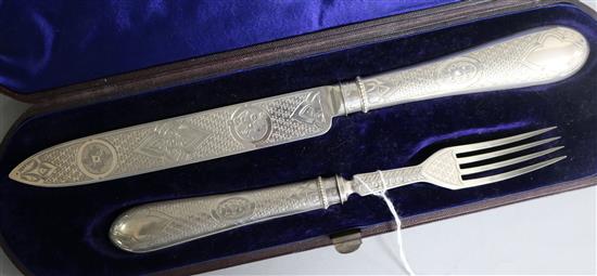 A cased Victorian silver carving knife and fork set, by Martin, Hall & Co, Sheffield, 1871.